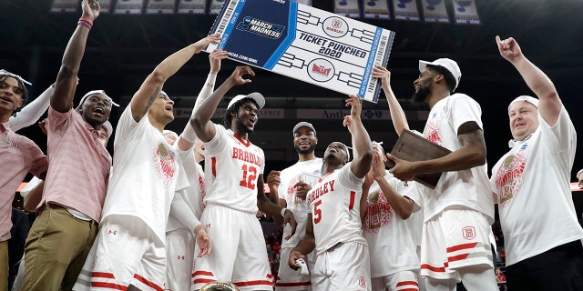 Members of Bradley celebrate after defeating Valparaiso 80-66 during an NCAA college basketball game in the championship of the Missouri Valley Conference men's tournament Sunday, March 8, 2020, in St. Louis. (AP Photo/Jeff Roberson)