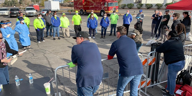 Volunteers and workers set up a temporary homeless shelter in a parking lot in Las Vegas on Saturday.