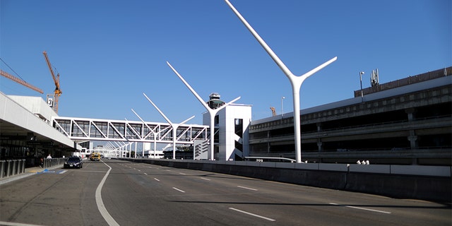 An empty road that runs past terminals is seen at LAX airport in Los Angeles, Calif., amid reports of the coronavirus, March 11, 2020. (REUTERS/Lucy Nicholson)