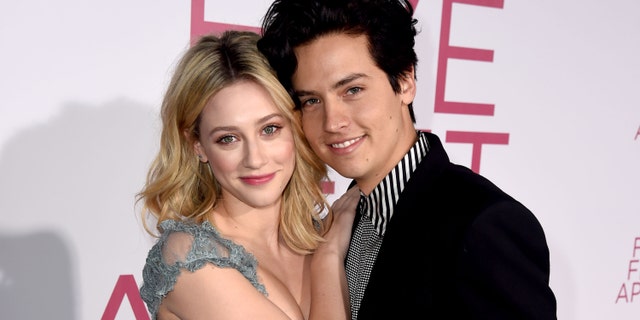 Lili Reinhart (L) and Cole Sprouse (R) arrive at the premiere of CBS Films' "Five Feet Apart" at the Fox Bruin Theatre on March 07, 2019 in Los Angeles, California.