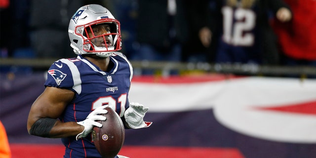 New England Patriots safety Duron Harmon (21) reacts after making an interception during the fourth quarter against the Minnesota Vikings at Gillette Stadium.