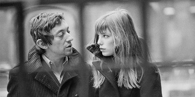 French singer and songwriter Serge Gainsbourg and his partner, British singer and actress Jane Birkin, in the courtyard of the French National College of Fine Arts, in Paris.