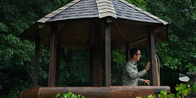 LOST CITY, WV-AUGUST 23: Drew Miller in one of his many guard towers at his West Virginia compound on August 23, 2019. Miller, a retired Air Force intelligence officer and Harvard-educated writer, has been establishing compounds for the apocalypse. So far about 100 people have joined.  (Photo by Michael S. Williamson/The Washington Post)