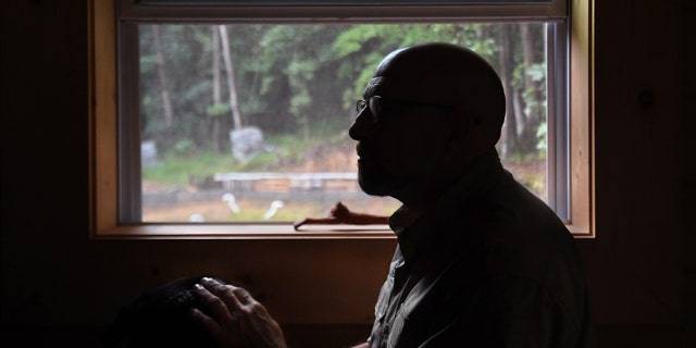 Fortitude Ranch employee Steve Rene keeps an eye on the property from his fortified home in this August 2019 photo.