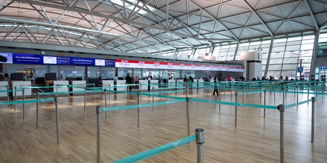 Check-in counters at Incheon International Airport in South Korea, seen here on March 3, appear virtually empty.