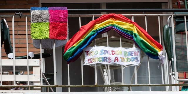 Fabric rainbow adorns a balcony in Madrid as a symbol of optimism and hope against the coronavirus in Madrid, Spain, on March 21. (Alvaro Hurtado/NurPhoto via Getty Images)