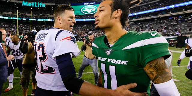 Tom Brady #12 of the New England Patriots shakes hands with Robby Anderson #11 of the New York Jets after his 33-0 win at MetLife Stadium on October 21, 2019 in East Rutherford, New Jersey. (Photo by Steven Ryan/Getty Images)