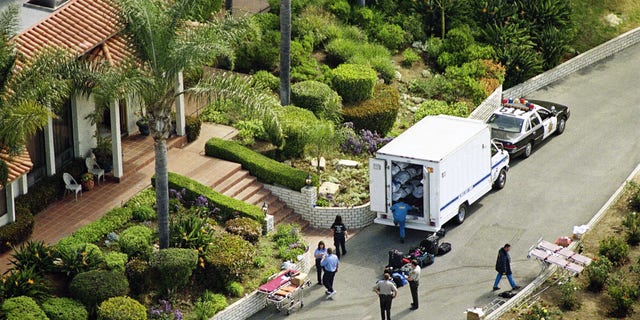 A truck containing some of the bodies of the Heaven's Gate cult, which committed mass suicide, is shown outside the cult's compound in San Diego, Calif. (AP Photo)