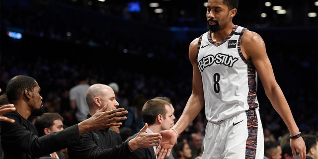 Spencer Dinwiddie of the Brooklyn Nets high-fives coaches after coming out of the game during the first half against the Miami Heat at Barclays Center on January 10, 2020 in the Brooklyn borough of New York City. (Sarah Stier/Getty Images)