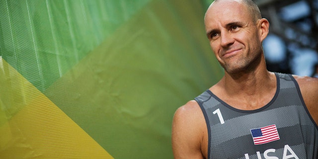 FILE - In this Aug. 8, 2016, file photo, Jake Gibb, of the United States, waits to be introduced to the crowd for a men's beach volleyball match against Austria at the Summer Olympics in Rio de Janeiro, Brazil. Since the spread of coronavirus, high-stakes events in China have been postponed until after the Summer Games or canceled outright; more are in jeopardy, and the five-star World Tour Finals are in Italy, another focus of the outbreak. (AP Photo/David Goldman, File)
