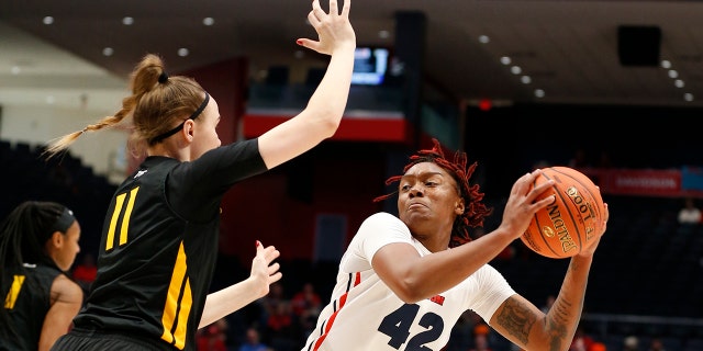 Dayton guard Jayla Scaife (42) is pressured by Virginia Commonwealth forward Kseniya Malashka (11) during the first half of the women's Atlantic 10 championship NCAA college basketball game, Sunday, March 8, 2020, in Dayton, Ohio. (AP Photo/Gary Landers)
