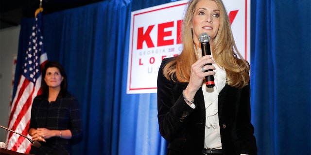 Sen. Kelly Loeffler, R-Ga., right, speaks as former U.N. Ambassador Nikki Haley looks on during a re-election campaign rally Monday, March 9, 2020, in Marietta, Ga. (AP Photo/John Bazemore)