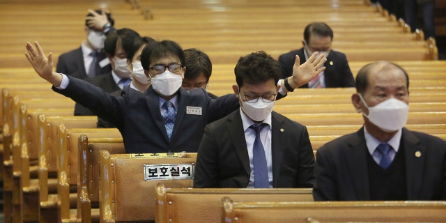 People wearing face masks pray during Mass at the Yoido Full Gospel Church in Seoul, South Korea, Sunday. The church decided to replace Sunday services with online ones for members' safety amid the spread of the COVID-19. (AP Photo/Ahn Young-joon)