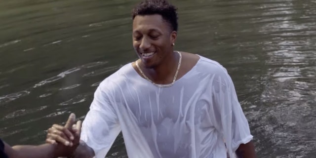 Lecrae gets baptized in the Jordan River.