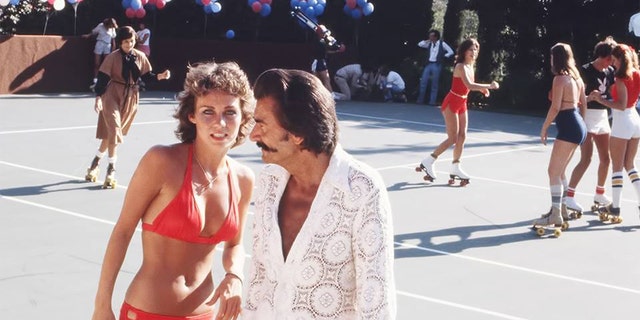 Candace Collins Jordan with LeRoy Neiman at the Playboy Mansion. 