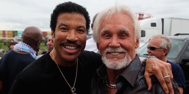 Vocalists Lionel Richie (L) and Kenny Rogers are seen here backstage during the 2012 Bonnaroo Music and Arts Festival on June 10, 2012, in Manchester, Tennessee. 