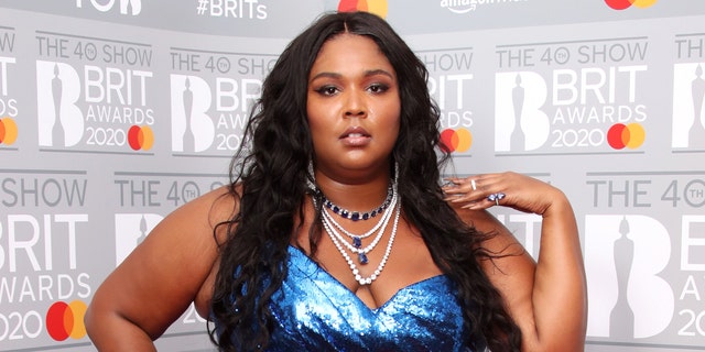 Lizzo, pictured here in the winner's rooms at The BRIT Awards 2020 in February 2020, covered the October issue of Vogue. 