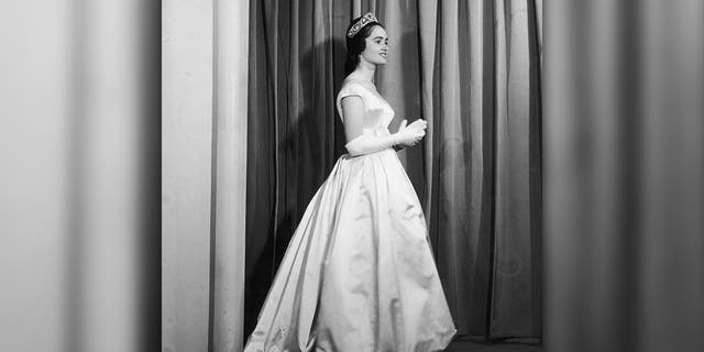 Maria Teresa of Bourbon-Parma wearing a Jacques Heim evening dress. 