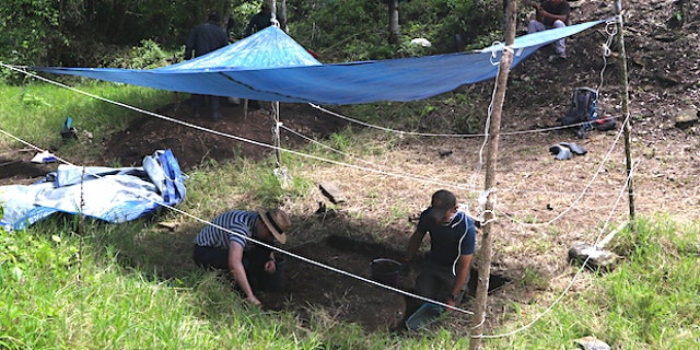 Schroder (left) and Scherer (right) excavate in the ancient city's ballcourt.