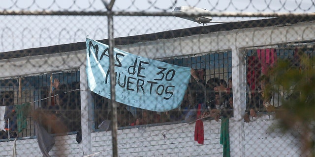 Colombia prison riot kills at least 23 amid coronavirus fears, officials say 2 Inmates display a sign reading in Spanish "More than 30 dead" at La Modelo jail in Bogota, Colombia, Sunday, March 22, 2020. Violence broke out in the prison out of inmates' fears that authorities are not doing enough to prevent coronavirus inside overcrowded prisons.