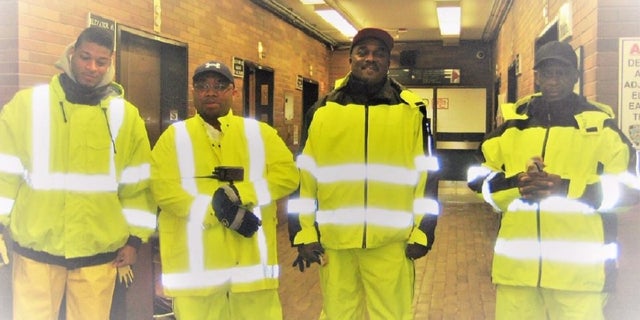 This photo show Dennis Dickson, third from the left, during the cleanup of Superstorm Sandy in 2012. Dickson, a custodian with the New York Police Department, became the agency’s first employee to die from the coronavirus, the NYPD said Thursday.