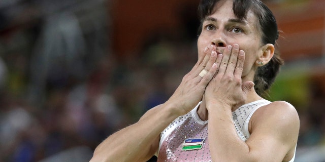 In this Sunday, Aug. 7, 2016 file photo, Uzbekistan's Oksana Chusovitina acknowledges the audience after her routine on the balance beam during the artistic gymnastics women's qualification at the 2016 Summer Olympics in Rio de Janeiro, Brazil. (AP Photo/Rebecca Blackwell, file)
