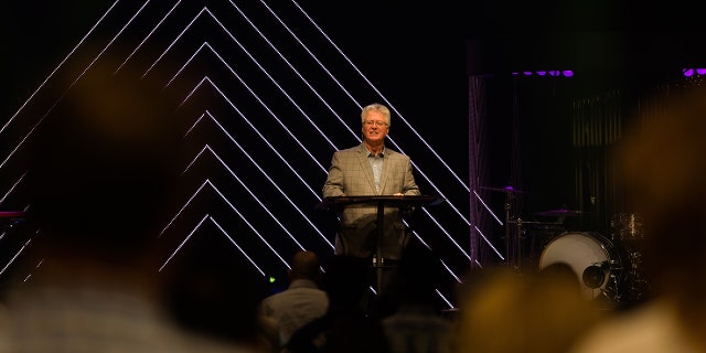 Tom Walters, the senior pastor of Word of Life Church, preaches to his congregation. This week he apologized for keeping the doors open for service Sunday amid the coronavirus pandemic.
