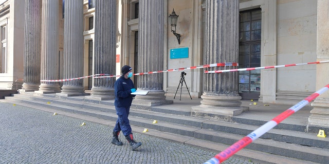 Policewoman walks outside the Green Vault city palace, unique historic museum that contains the largest collection of treasures in Europe after a robbery in Dresden, Germany, November 25, 2019. REUTERS/Matthias Rietschel 