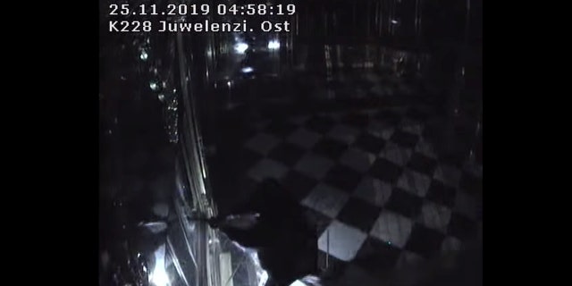 Thieves with torches and tools break into one of the display cabinets in Green Vault museum in Dresden, Germany, November 25, 2019 in this still image taken from a security video. Saxony Police Department/Handout via REUTERS