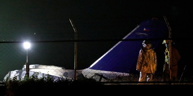 Debris of the Lion Air medical evacuation plane, that exploded during takeoff, is seen on the runway of Manila International Airport in Pasay City, Philippines.