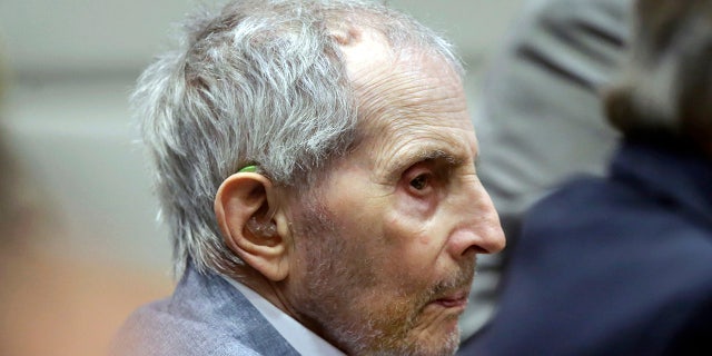 FILE - In this Tuesday, March 10, 2020, file photo, real estate heir Robert Durst listens to his defense attorney give their opening statement during his murder trial in Los Angeles. Durst's trail has been delayed for three weeks over fears of the transmission of coronavirus and will stand adjourned until April 6. (AP Photo/Alex Gallardo, Pool, File)