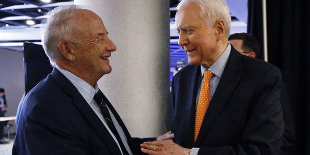 Robert Garff, left, greets U.S. Sen. Orrin Hatch, R-Utah, during the UTGOP election night party in Salt Lake City on Tuesday, Nov. 6, 2018.