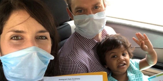 Chris Santa Maria and his wife Caeli and their adopted daughter from India.