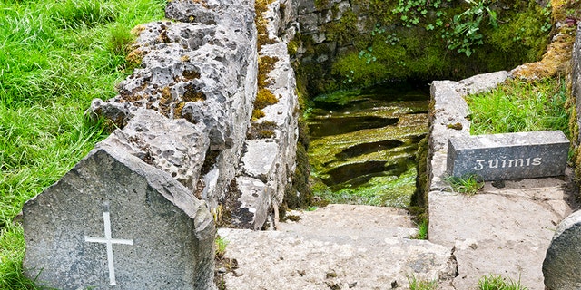 The Well of Saint Patrick at Ballintubber Abbey in Ballintubber, County Mayo, Ireland. He baptised the people in year 441AD at the well. Beside the well there is a stone on which the supposed imprint of the Saint’s knee is on it.