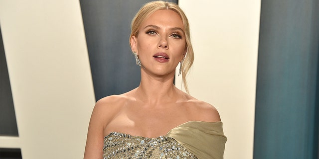 Scarlett Johansson said she does not want to feel compelled to play a 'public role in society'.