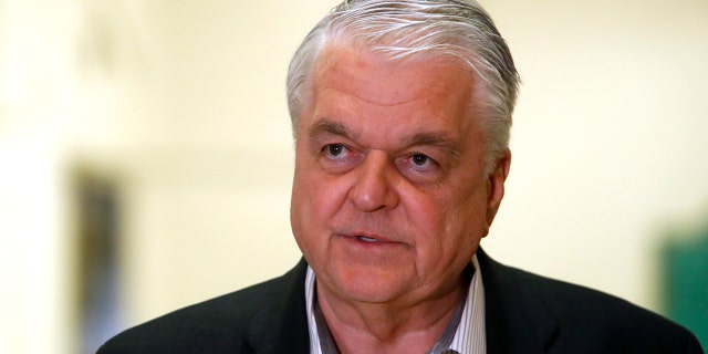 In this Tuesday, March 17, 2020 photo, Democratic Nevada Gov. Steve Sisolak speaks during a news conference at the Sawyer State Building in Las Vegas.