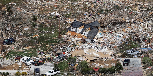 The remains of homes shattered by storms are scattered near Cookeville, Tenn., Tuesday, March 3, 2020.