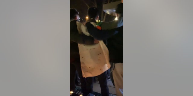 Prajesh Patel, a senior at Penn State, organized the vigil and gave a speech while wearing a tortilla costume.