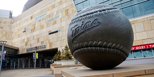 A giant baseball sculpture sits outside Target Field, home of the Minnesota Twins baseball team, Wednesday, March 25, 2020 in Minneapolis. Though the Twins would open on the road, the start of the regular season is indefinitely on hold because of the coronavirus pandemic. 