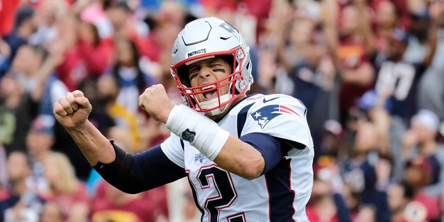 FILE - In this Oct. 6, 2019, file photo, New England Patriots quarterback Tom Brady (12) reacts to a touchdown against the Washington Redskins during the second half of an NFL football game in Washington.