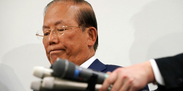 Toshiro Muto, CEO of the Tokyo 2020 Organizing Committee, listens to reporters' questions during a news conference in Tokyo Tuesday, March 17, 2020. (AP Photo/Eugene Hoshiko)
