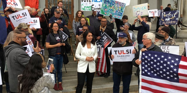 Democratic presidential candidate Rep. Tulsi Gabbard joins supporters after filing to place her name on New Hampshire's presidential primary ballot, in Concord, NH in Nov. 2019.