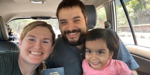 Michael and Whitney Saville and their adopted daughter Grace. They are all stuck in India because of the country's coronavirus lockdown.