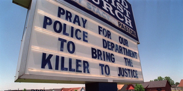 Photo circa 1993: A sign of police support hangs at Second Baptist Church on E. Barton Street in West Memphis Friday afternoon. The church is down the street from the wooded area where the bodies of the three boys were found.