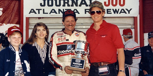 Dale Jr. (far left) was in Atlanta to see his dad win the 1986 race and won it himself in 2004.