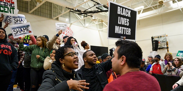 Protestors on stage during a rally for Democratic presidential candidate Sen. Amy Klobuchar (D-MN) on March 1, 2020 in St Louis Park, Minnesota.  (Photo by Stephen Maturen/Getty Images)