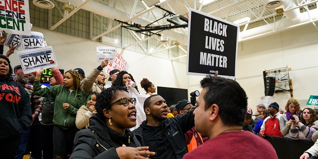 Protestors on stage during a rally for Democratic presidential candidate Sen. Amy Klobuchar (D-MN) on March 1, 2020 in St Louis Park, Minnesota. (Photo by Stephen Maturen/Getty Images)