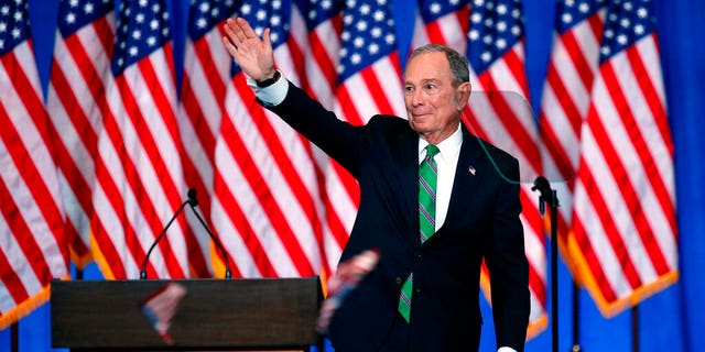 Former Democratic presidential candidate Mike Bloomberg waves to supporters as he announces the suspension of his campaign and his endorsement of former Vice President Joe Biden for president in New York Wednesday, March 4, 2020. (AP Photo/Eduardo Munoz Alvarez)