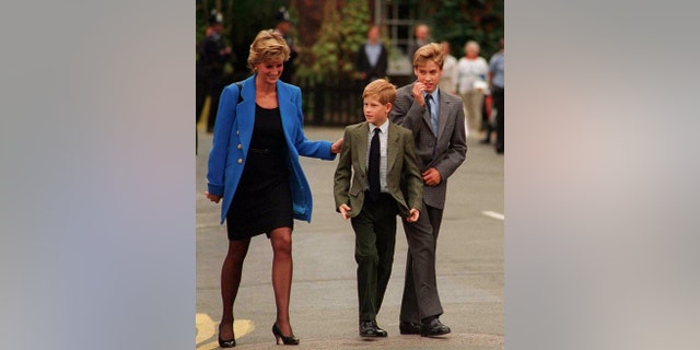 Prince William arrives with Diana, Princess of Wales and Prince Harry for his first day at Eton College in 1995, in Windsor, England