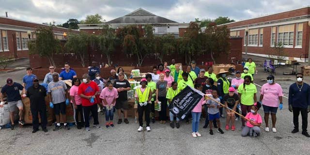 Community Warriors volunteers helping get food to people in need.